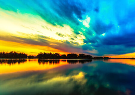 Amazing sunset sky reflection on the riverの写真素材