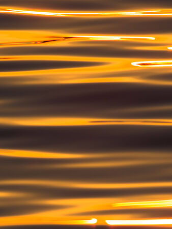 Natural textile pattern of the surface sunset lakeの写真素材