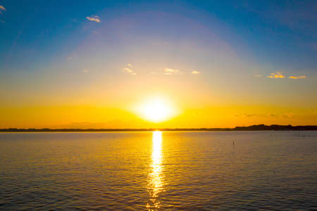 Colors of sunset and the surface of a lake, Japanの写真素材