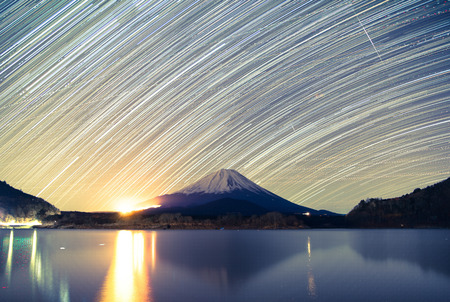 Mount Fuji, Lake Shojiko and star trails of winter starsの写真素材