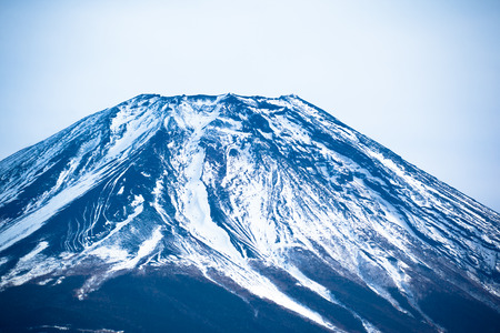 The top of Mount Fuji covered in snowの写真素材
