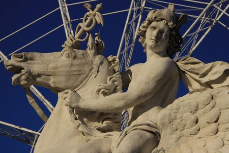 Horseman statue on the Place de la Concorde with ferris wheel at background, Paris, Franceの写真素材