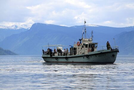 ALTAI, RUSSIA - JUNE 13, 2013: A touristic boat on Teletskoye Lake, Altai mountains
