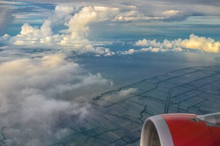 plane window and up in the sky at bali, indonesia