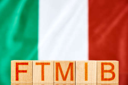 ftmib index italy. wooden blocks with the inscription ftmib on the background of the flag of italyの写真素材