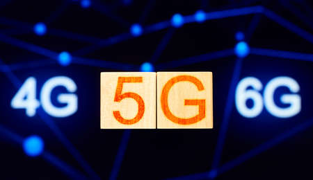5g concept. wood blocks with 5g lettering on background with 4g and 6g letteringの写真素材