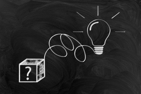 chalk drawn cube with a question mark and a light bulb.の写真素材
