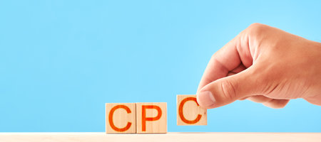 man is lining up wooden blocks in the cpc lettering. cost per click conceptの写真素材