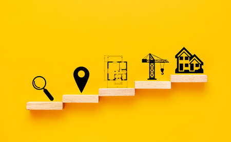 House construction concept. sequence of icons on wooden blocks - magnifier, geolocation mark, drawing, Construction crane, houseの写真素材