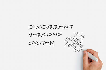 Concurrent Versions System - a man writes an acronym with a marker on paper and draws gearsの写真素材