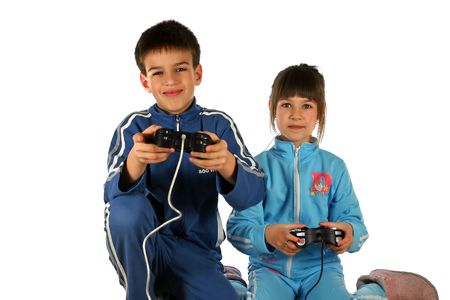 Young boy and girl enjoying a computer game, isolated on white backgroundの写真素材