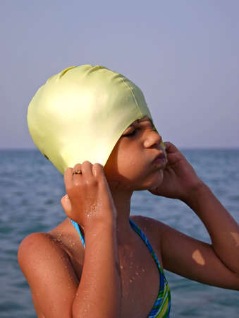 Little girl on the beach, sea wavesの写真素材