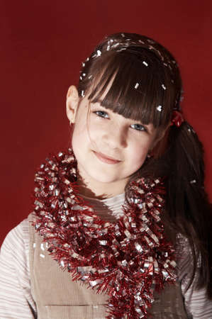 Young girl with confetti in her hairの写真素材