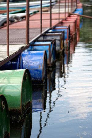 colourful river boats on the dockの写真素材