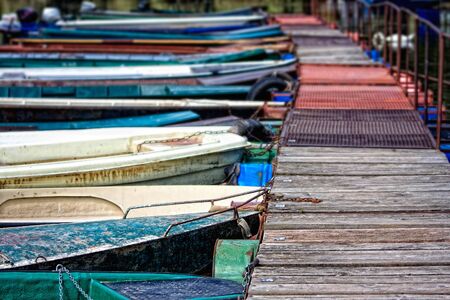 colourful river boats on the dockの写真素材