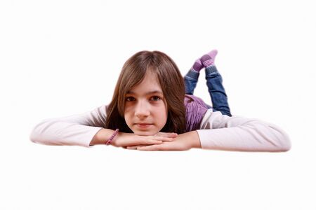 girl lying on the floor, isolated on whiteの写真素材