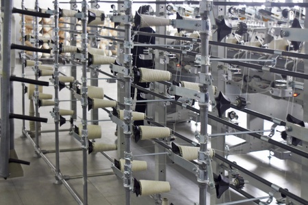 Detail of an indoor industrial production line, in a textile factoryの写真素材
