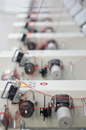 Detail of an indoor industrial production line, in a textile factory