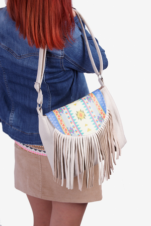 girl in boots, wearing modern purse の写真素材