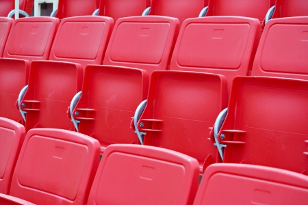 New red and white chairs in the stadiumの写真素材
