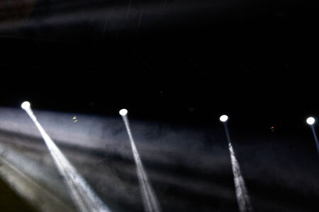 colorful concert lighting on a dark backgroundの写真素材