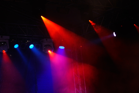 Image of colorful concert lighting on a dark backgroundの写真素材