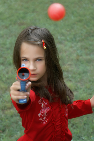 The plastic children gun with plastic ballの写真素材