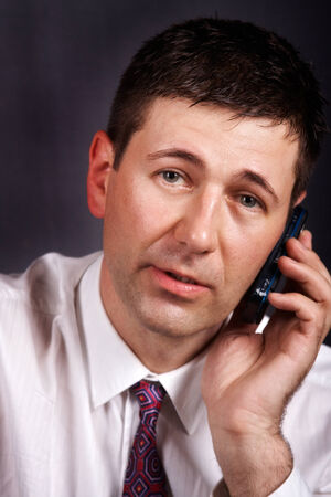 Portrait of businessman talking on the phoneの写真素材