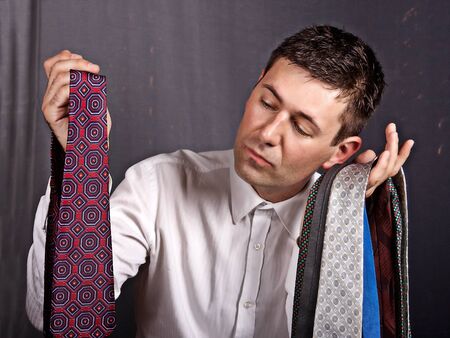 Portrait of a man who chooses tieの写真素材