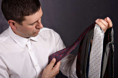 Portrait of a man who chooses tieの写真素材