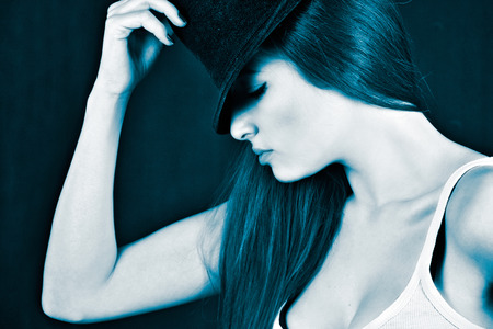 Beautiful young girl wearing a fedora hatの写真素材