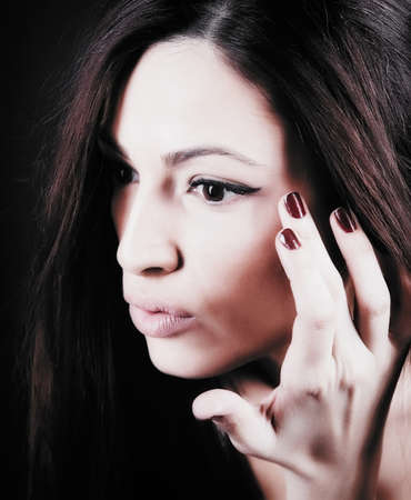 Beautiful Young Woman touching her Face. Skincare .Perfect Skinの写真素材