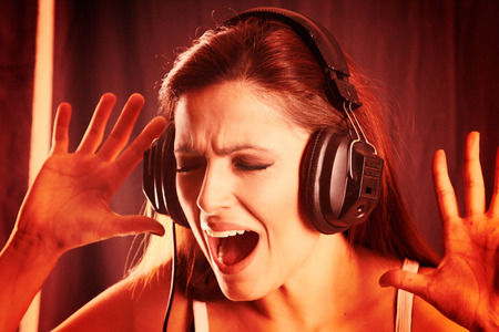 Portrait of a young girl listening to music with headphonesの写真素材