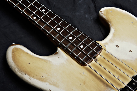 Electric bass guitar closeup, focus on stringsの写真素材