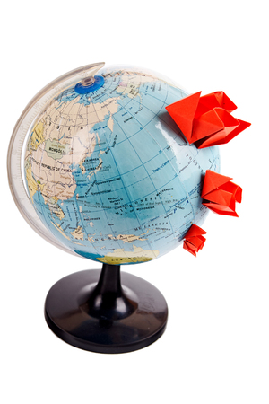 Traveling concept, ship from a paper on the geographical map background, clipping pathの写真素材