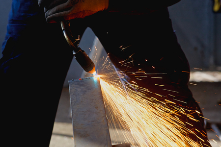 Cutting metal sheet with propane oxygen gas blow torch burner equipmentの写真素材