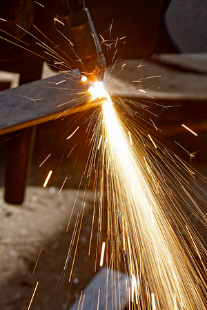 Cutting metal with propane, oxygen, acetylene torch, burner equipmentの写真素材