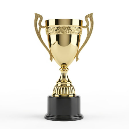 The image depicts a golden trophy with intricate designs. The trophy has two handles on either side and is mounted on a black base. The handles are adorned with ornate patterns, and the body of the trophy features a reflective, polished surface. The base is round and provides a stark contrast to the golden hue of the trophy.の素材