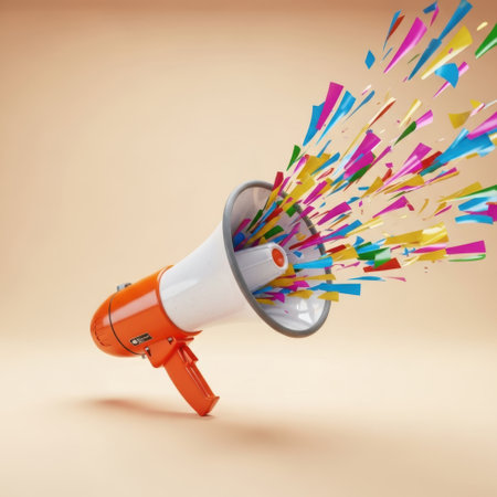 The image depicts an orange and white megaphone from which a burst of colorful confetti is being released. The confetti pieces are in various bright colors including pink, blue, green, yellow, and orange, creating a festive and celebratory atmosphere. The megaphone is positioned diagonally, and the confetti is scattered in all directions, emphasizing the dynamic and lively nature of the scene.の素材
