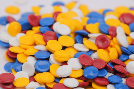 Colorful plastic polymer granules on white