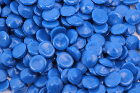 blue color chemistry plastic granulate in light for background / pellets material factory