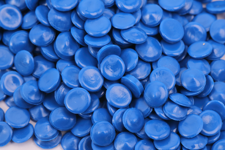 blue color chemistry plastic granulate in light for background / pellets material factory