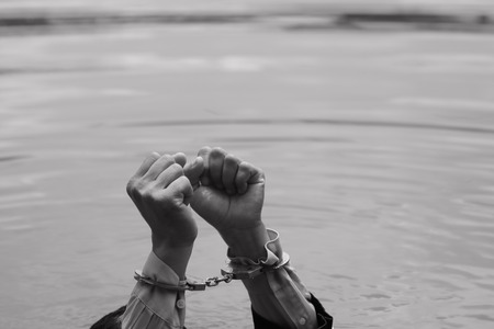 Businessman gets put his hands is drowning handful.