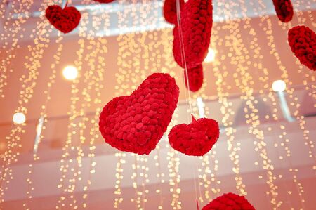 Large  hearts of flowers that float in the air among the gold garlands Related words syn.の写真素材