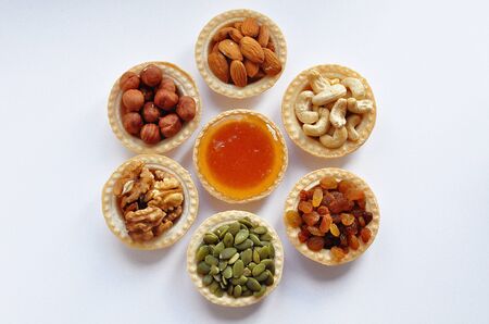Bright colorful nuts in tartlets for a healthy vegetarian breakfastの写真素材