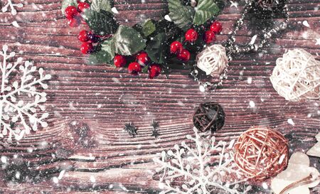 Christmas background of Christmas toys, spruce twigs, snowflakes, stars, rattan balls and tinsel on...