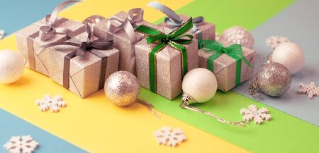 Christmas  graphic multi-colored background  from yellow, green and blue paper with a geometric...