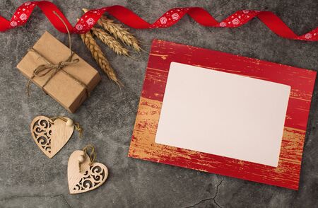 Holiday background for Valentines Day on a gray cement background with red retro hearts and gifts with place for text.の写真素材