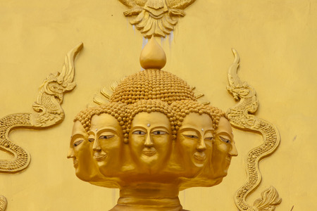Eight head golden buddha statue.の写真素材