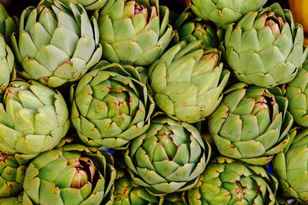 Group of artichokes. Healthy fresh artichokes are grown on an organic farm. Royalty high-quality free stock image of vegetables. Food backgroundの写真素材